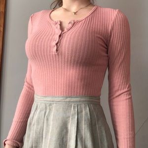 Pink half button up tightly fit long sleeve top